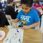 Yeshua Del Rosario, in Carolyn Luengens third-grade class, crafts a piece of art at a Helen Haller Elementary School after-school club. Submitted photo