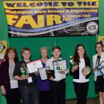 Sequim students in grades 7-10 celebrate top finishes at the Washington State Science and Engineering Fair on March 23. Pictured, from left, are mentor Debra Beckett, Chase Swartz, mentor Mary Omberg, Richard Meir, Karlie Viada and Vita Olson. Not pictured are Keyana Cundiff and Paola Villegas. Submitted photo