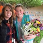 Last Friday, Paige Krzyworz was surprised by her mom Heidi and fifth grade teacher Gail Kite, pictured, to learn she sold the most Girl Scout cookies in Western Washington. Girl Scouts of Western Washington sent a bouquet to Helen Haller Elementary to celebrate. Photo courtesy of Heidi Krzyworz