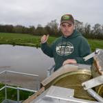 Ryan McCarthey, co-owner of the Dungeness Valley Creamery, stands by the farms new manure separator, the DTX Separator from Daritech Inc. of Lynden, that separates liquid and solid manure and recycles liquids to help clean cow stall alleyways more frequently. Sequim Gazette photo by Matthew Nash