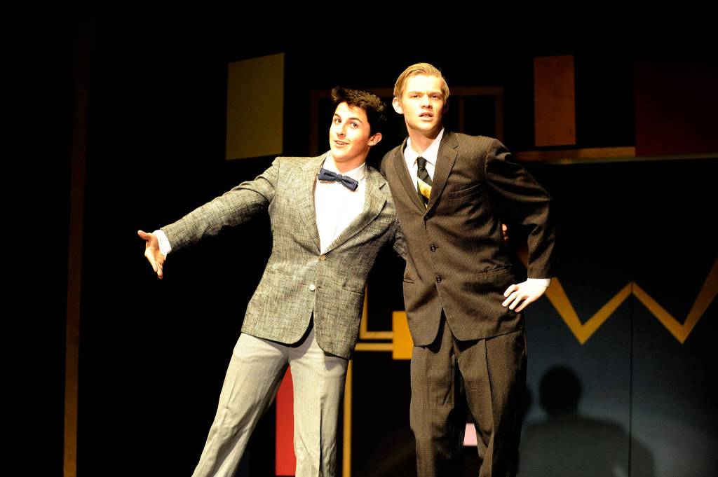 Thomas Hughes and Jonathan Heintz act out an animated scene from How to Succeed in Business Without Really Trying. Sequim Gazette photo by Erin Hawkins