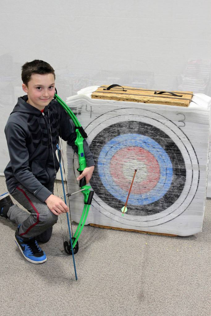 Max Lee scored a rarity at Greywolf Elementary recently, splitting an arrow with a well-placed arrow of his own. Photo by Doug Hastings