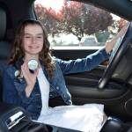 Sara German won this years Sequim Irrigation Festival button design contest and the chance to ride in a limo with friends to lunch on May 1. Sequim Gazette photo by Matthew Nash