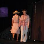Sequim-Dungeness Hospital Guild volunteers Mary Nesbitt and Rebecca Wallace, foreground, model a five-piece retro ensemble at the annual Guild luncheon and fashion show at 7 Cedars Casino on May 3. Sequim Gazette photo by Erin Hawkins