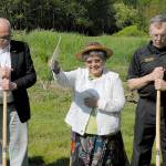 Jamestown SKlallam tribal elder Elaine Grinnell, center, gives a blessing over the site of the tribes future public safety and justice center in Blyn while surrounded by the tribal council Chairman Ron Allen, left, and Clallam County Sheriff Bill Benedict on Saturday. Photo by Keith Thorpe/Peninsula Daily News