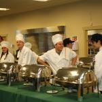 Teens, from left, Austin Henning, Sydney Swansen, Devin Anderson, Caleb DeMott, David Simonson and Samantha White in Sequim High Schools Culinary Arts class helped prepare and serve the meal at the Sequim Sunrise Rotarys annual dinner. Photo by Ernst-Ulrich Schafer