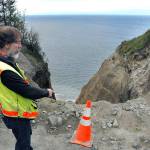 Assistant Clallam County engineer Joe Donisi looks over an eroded section of bluff caused by a damaged drainage culvert under West Bluff Road in The Bluffs neighborhood between Sequim and Port Angeles on May 10. Photo by Keith Thorpe/Peninsula Daily News