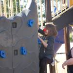 Sophia Treece, a fifth grader at Greywolf Elementary School, climbs the rock wall at the Helen Haller playfields as part of the Boys & Girls Clubs Red Nose Day Ninja Warrior event.