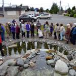 Ty Brown, Sequim operations manager, speaks to the crowd on May 16 about how the city worked with the Lotzgesell family, Priscilla Hudson and other Sequim Prairie Garden Club members in refurbishing the fountain Pioneer Memorial Park. Sequim Gazette photo by Matthew Nash