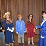 Mary Poppins (Rebekah Parker), on right, greets the Banks family, from left, George and Winifred (Abram Yeater and Emily Nielsen) and Michael and Jane (Ari Skov and Alyssa Alcaraz) in a rehearsal for Olympic Peninsula Academys production of Mary Poppins JR set for June 1-2 with a dress rehearsal on May 31. Sequim Gazette photo by Matthew Nash