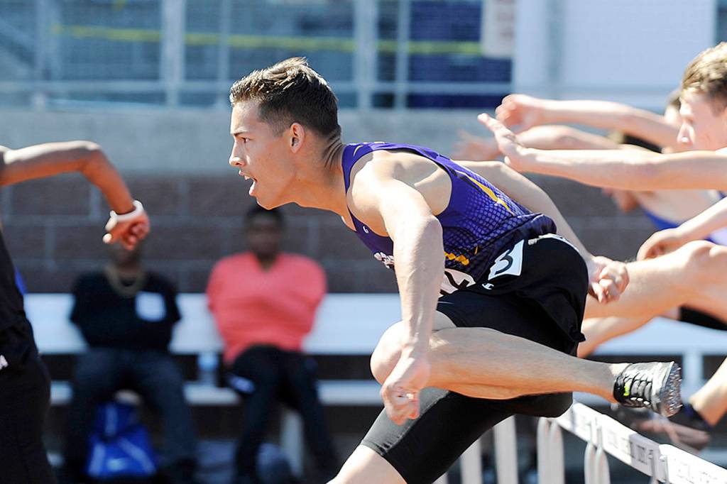 Sequim junior Riley Martin clears an early hurdle on his way to a top-two finish in his 110 high hurdles preliminary heat at the class 2A state track and field finals in Tacoma on May 24. Martin went on to place third in the finals. Sequim Gazette photos by Michael Dashiell                                Sequim junior Riley Martin clears an early hurdle on his way to a top-two finish in his 110 high hurdles preliminary heat at the class 2A state track and field finals in Tacoma on May 24. His 15.39-second finish was third best in the preliminaries and earned Martin a spot in the finals. Sequim Gazette photo by Michael Dashiell