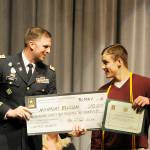 U.S. Army recruiting officer Cpt. Josh Woodke gives Sequim High graduate-to-be Nick Ellison an Army ROTC Scholarship worth $184,000. Ellison, who will attend Gonzaga University in the fall, received more than $230,000 in scholarships. Sequim Gazette photo by Michael Dashiell