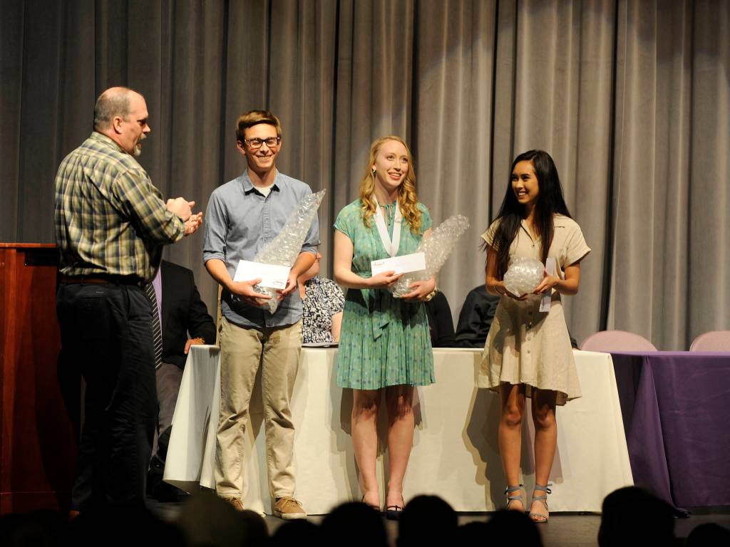 Shipley Center Executive Director Michael Smith, left, gives scholarships and trophies along with, as his tradition, some bubble wrap  Dont pop pills, pop bubble wrap  to SHS graduating seniors Josiah Carter, Abby Norman and Andrea Albaugh. Sequim Gazette photo by Michael Dashiell