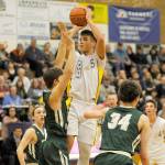 Payton Glasser, shooting a jumper over the Port Angeles defense in an Olympic League game during the 2017-2018 season, takes his hoops talent to Northwest University later this year. Sequim Gazette file photo by Michael Dashiell