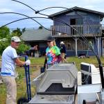 Rick Reed of Dallas, Texas, and Andrea Putnam of Princeton, NJ., move a dryer during Sequim Service Fests first house clean-up on June 5. Both Reed and Putnam plan to stay and volunteer in Sequim through the events finish on June 15. Sequim Gazette photos by Matthew Nash