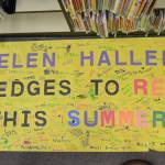 Students and staff at Helen Haller Elementary signed a banner pledging to read this summer. Sequim Gazette photo by Matthew Nash