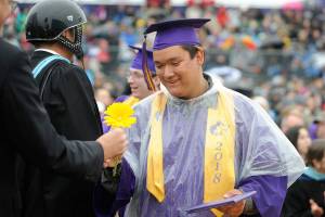 Rain does not stop smiles on this SHS grad parade