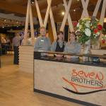 The House of Seven Brothers host staff, from left, Johnny Davis, Emily Prendergase, and Kathleen Williams welcome guests as they come into the restaurant. Sequim Gazette photo by Erin Hawkins