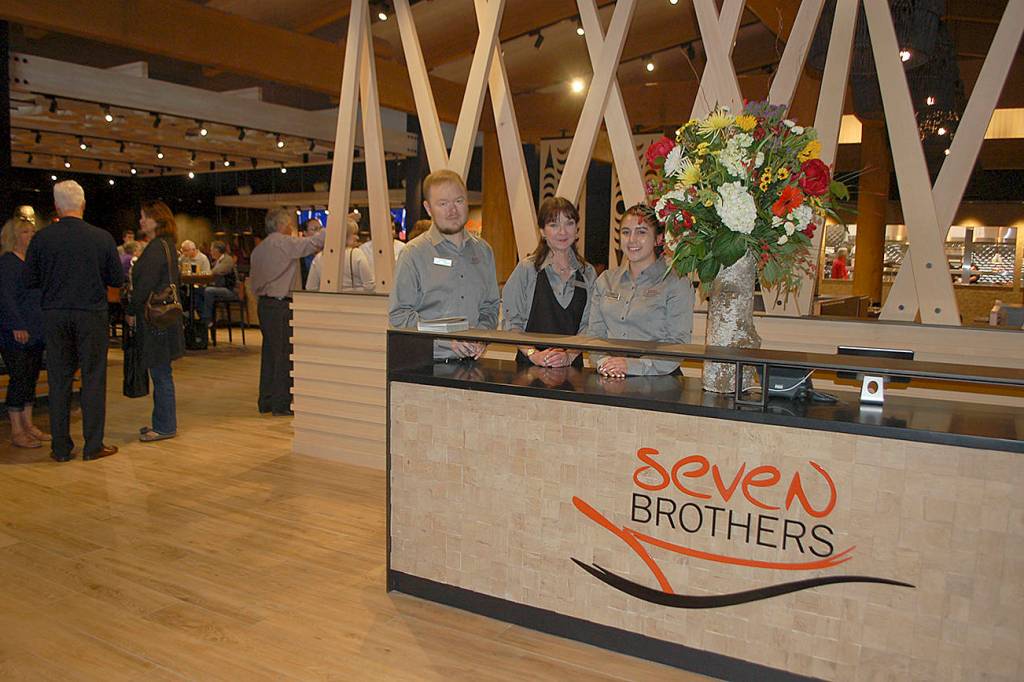 The House of Seven Brothers host staff, from left, Johnny Davis, Emily Prendergase, and Kathleen Williams welcome guests as they come into the restaurant. Sequim Gazette photo by Erin Hawkins
