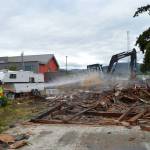 A crew during Service Fest demolish a home at 169 W. Spruce St. on June 6 thats had a long history of reported issues to Sequim Police Department. The City of Sequim partnered with its homeowner to demolish it as part of Sequim Service Fest. Leaders with Habitat for Humanity report it took a dozen truckloads to remove the homes contents. Sequim Gazette photo by Matthew Nash