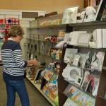 Betty Switzer of Sequim peruses through cards at the new Hallmark department at the Co-op Farm & Garden store. Sequim Gazette photo by Erin Hawkins