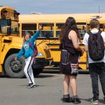 Sequim High sophomore Gemma Davis gives a peace sign as she and fellow students leave the Sequim campus on the last day of school (June 15). Sequim Gazette photo by Erin Hawkins
