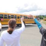 Staff and parents at Greywolf Elementary School wave goodbye to students on the last day of school on June 15, an early-release day. Sequim Gazette photo by Michael Dashiell