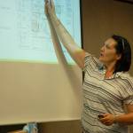Vanir Construction Management Inc. project director Tobi Maggi shows a layout of Sequim School Districts new central kitchen at the board meeting on June 18. Sequim Gazette photo by Erin Hawkins