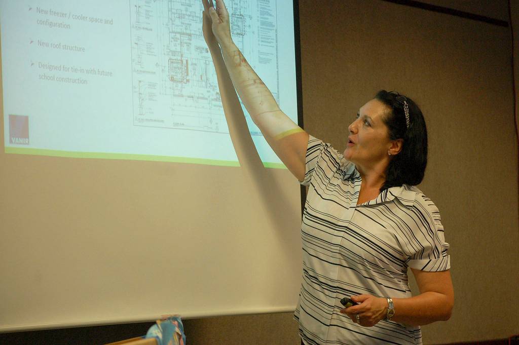 Vanir Construction Management Inc. project director Tobi Maggi shows a layout of Sequim School Districts new central kitchen at the board meeting on June 18. Sequim Gazette photo by Erin Hawkins