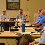 State Representatives Steve Tharinger and Mike Chapman discuss funding strategies for completing the Simdars Road interchange off East Washington Street on June 11 with Sequim City Councilors. They said packaging it with other improvements such as safety concerns at Palo Alto and Happy Valley Roads may be best. Sequim Gazette photos by Matthew Nash