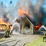 Fire crews from District 2 (Port Angeles and 3 (Sequim) respond to a fully involved, two-story structure fire near the end of Lake Farm Road on June 19. All of the occupants had evacuated the house at 131 Pristine Lane, Clallam County Fire District No. 3 Chief Ben Andrews said. Photo by Jay Cline/Clallam Fire District No. 2