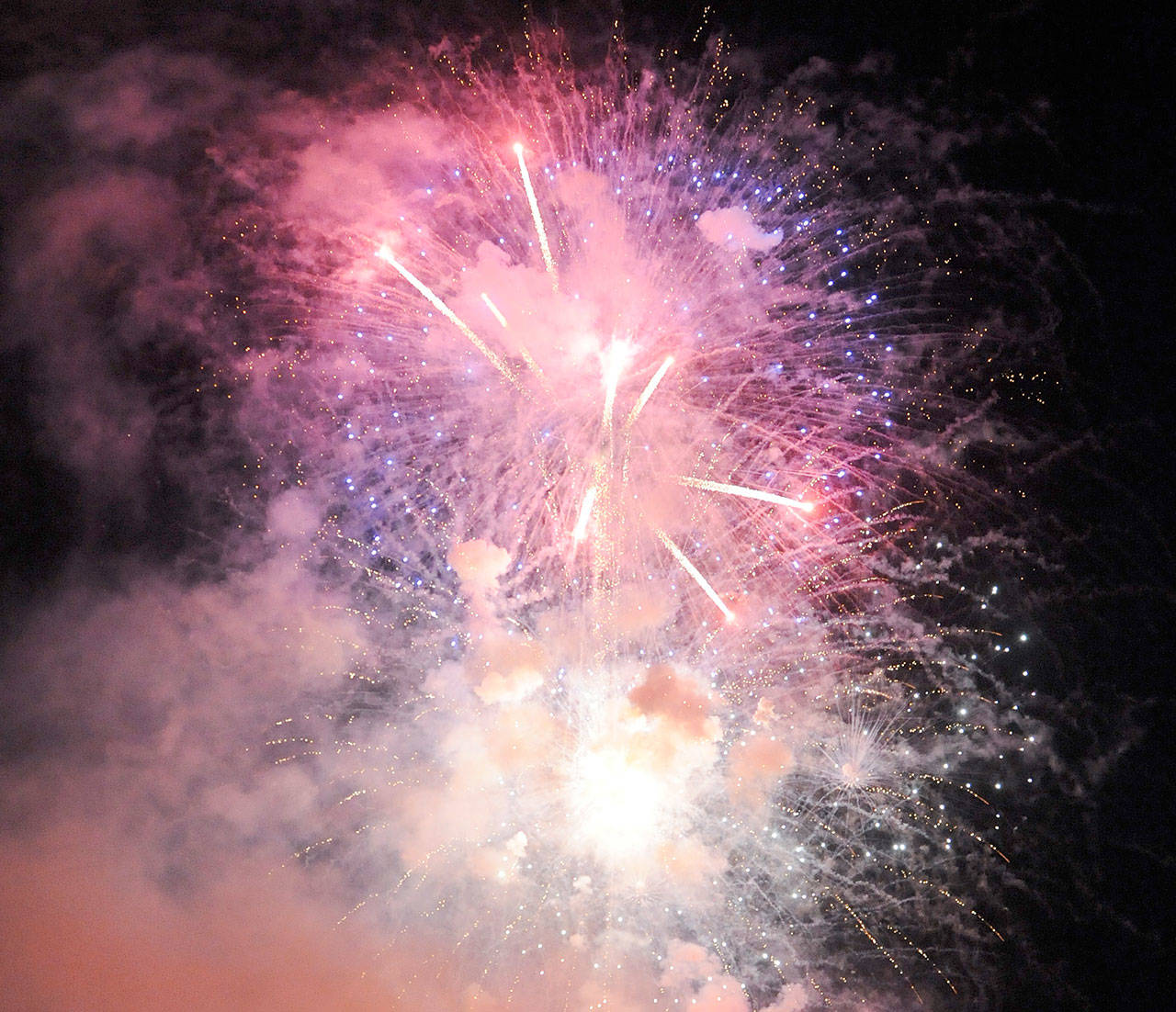 Festival-goers enjoy a fireworks display following the Sequim Irrigation Festival Logging Show in May. Under a new ordinance fireworks public display are allowed in Sequim city limits but residents cannot discharge commercial fireworks. Sequim Gazette file photo by Michael Dashiell