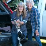 Jaye Moore, director of the Northwest Raptor & Wildlife Center, stands with Suzanne Anaya and her dog Champ after they rescued Harold Heron, Jr., near Sequim Bay from a tree. Photo courtesy Ken Kennedy