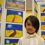 Mason Blake, 6, says his favorite piece follows Vincent Van Goghs style. Mason and about 20 other kindergarteners stayed after school with his teacher Stephanie Grotzke-Nash for five weeks making art in the style of different artists. Sequim Gazette photo by Matthew Nash