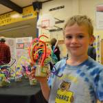 Silas Sullivan, 6, holds up his sculpture following the style of Alexander Calder. Silas worked in Stephanie Grotzke-Nashs art class to shape and place pipe cleaners in clay to make his art just right. Sequim Gazette photos by Matthew Nash