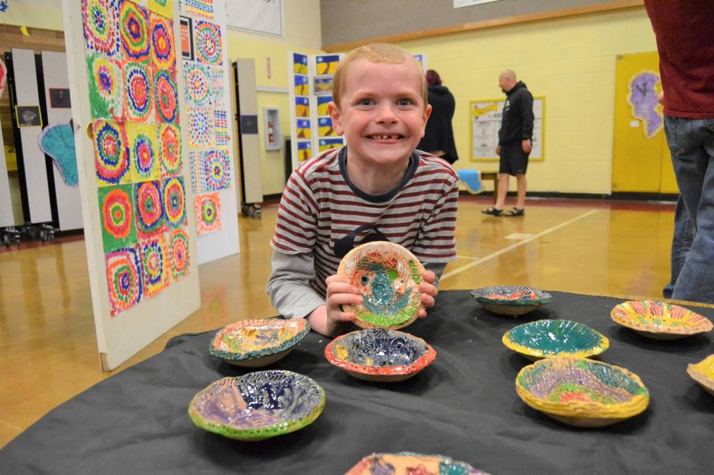 Taylor Thomas, 7, a second grader in Renee Mullikin and Kaylee Kinseys art class, holds his bowl he made for the art show. He said it was the most fun of all the projects to make.