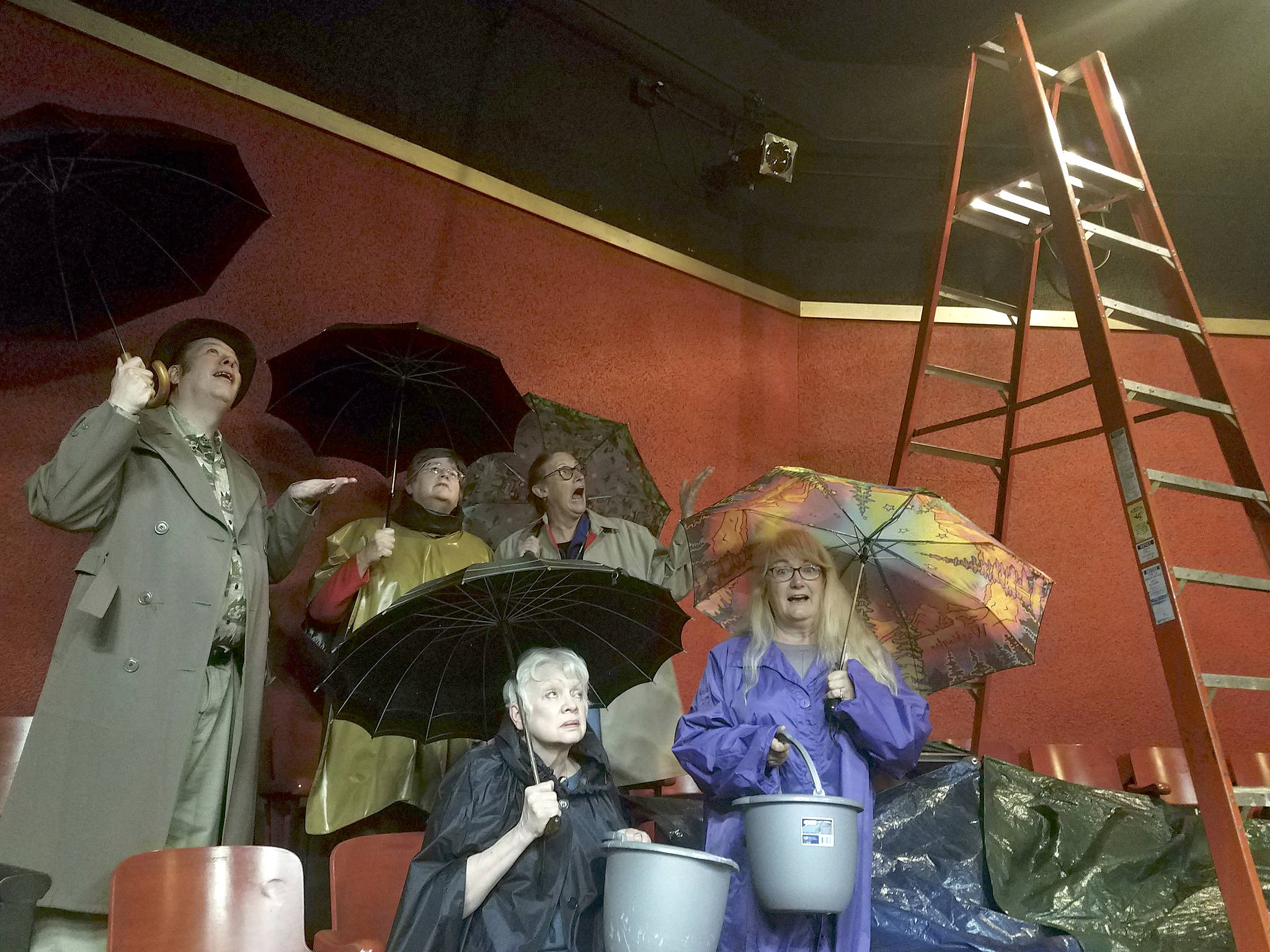 Members of the Port Angeles Community Players, from back left, Richard Stephens, Barbara Frederick, Jahanna Stewart, Janet Lucas and Kathy Balducci, discovered multiple leaks coming from the roof of the Port Angeles Community Playhouse theater earlier this month. They anticipate the cost for repairs to come in at about $21,000. Sumbitted photo