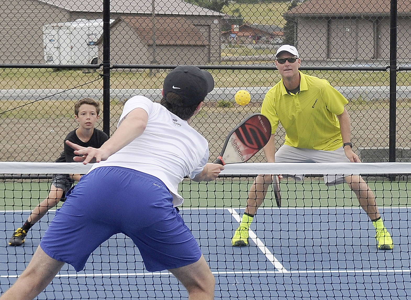 Getting some court time at the Sequim Picklers new pickleball courts at Carrie Blake Community Park are, from left, Garrett Little, Damon Little and Doug Hastings of Sequim. Sequim Gazette photo by Michael Dashiell