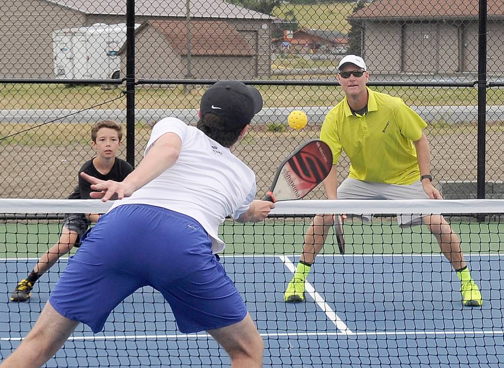 Getting some court time at the Sequim Picklers new pickleball courts at Carrie Blake Community Park are, from left, Garrett Little, Damon Little and Doug Hastings of Sequim. Sequim Gazette photo by Michael Dashiell