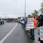 Protesters gather for a Families Belong Together rally near the U.S. Border Patrol building in Port Angeles on Saturday. Similar rallies were taking place across the country to protest federal immigration policies. (Rob Ollikainen/Peninsula Daily News)