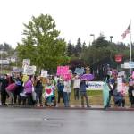 Protesters gather for a Families Belong Together rally near the U.S. Border Patrol building in Port Angeles on Saturday. Similar rallies were taking place across the country to protest federal immigration policies. (Rob Ollikainen/Peninsula Daily News)