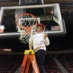MacKenzie Worley cuts down a net after he and fellow Boys & Girls Club campers enjoyed a Seattle Storm basketball game last week. Submitted photo