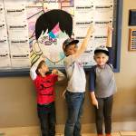 Boys & Girls Club campers show their kindness pledges after studying the book Wonder. Submitted photo