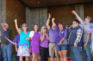 Sequim Lavender Festival kicked off at the opening ceremony at Carrie Blake Park on July 20, where Sequim City Clerk Karen Kuznek-Reese, left, Sequim-Dungeness Valley Chamber of Commerce representatives Melanie and Kelsey Sands, Sequim Mayor Dennis Smith, Festival Executive Director Debbie Madden, City Councilor Brandon Janisse, County Commissioner Mark Ozias and other Festival ambassadors performed a ribbon cutting ceremony.