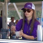 The Sequim Lavender Festival street fair featured about 180 vendors, such as 7 Cedars Casino, where bartender Jessica Kirby puts a lavender garnish into a cocktail at the business booth.