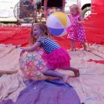 Sisters Goldie and Maisy Weeks from Poulsbo play with beach balls in one of Dream Cather Balloons at Olympic Lavender Heritage Farm during Sequim Lavender Weekend.