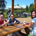 Kim Baltadonis of Tacoma, Caroline Hamilton of Gig Harbor and Michelle Huffmaster of Tacoma enjoy some lavender ice cream at Purple Haze Lavender Farm. Last Saturday, was Baltadonis first time to a Sequim lavender farm, she said, while Hamilton and Huffmaster have visited the last five years. Sequim Gazette photo by Matthew Nash