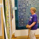 Mary Pat Minor of Sequim admires a quilt at the Sunbonnet Sue Quilt Clubs annual show on July 21 inside Sequim Middle School. Minor said shes come to the show every year since 2011. Sequim Gazette photo by Matthew Nash