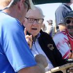 Barney McCallum, co-creator of the sport of pickleball, signs a racket and talks with Kendal Wake of Sequim at last weeks ribbon-cutting ceremony.