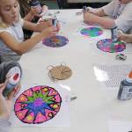 Campers work on stained glass art in the Boys & Girls Club art room. Submitted photo